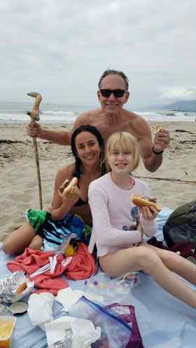 Richard Uzelac with his family on the beach.